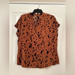 Burnt orange/tan blouse with black pattern